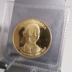Barack Obama Commemorative Coin in a protective sleeve